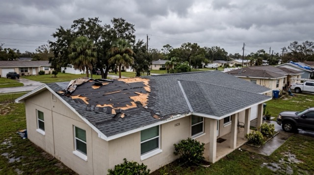 Florida roof showing storm damage on one section next to a repaired section illustrating the 25% replacement rule